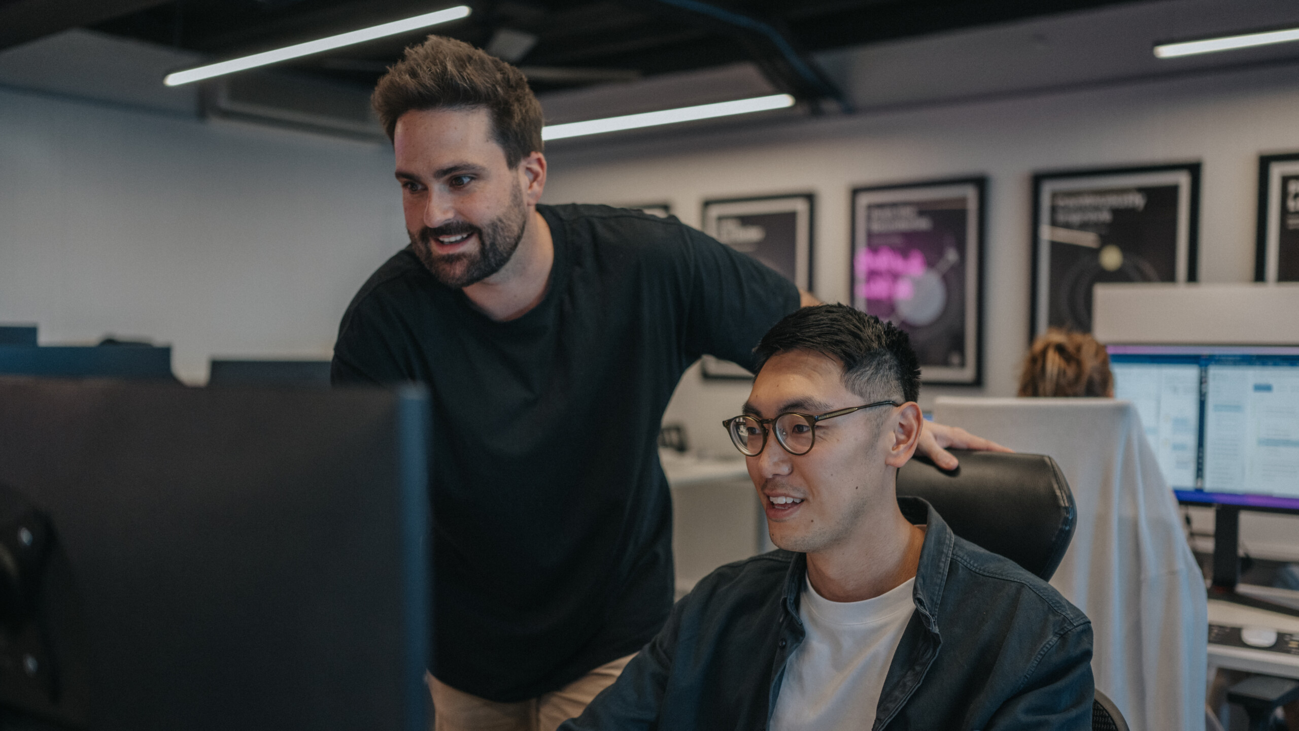 marketing experts working in front of a computer screen